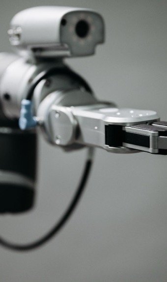 Robotarm i en automatiseret proces